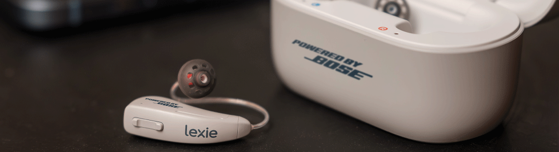 Lexie B2 Plus hearing aids with one hearing aid next to the case