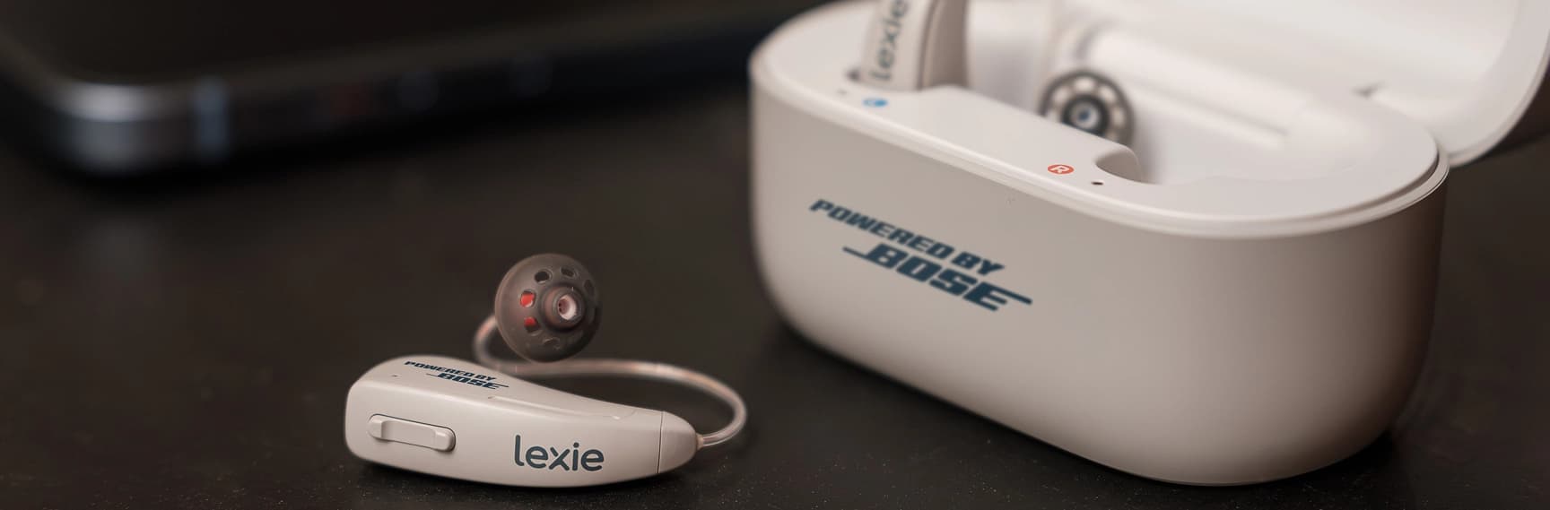 Charging Lexie B2 Plus hearing aids Powered by Bose
