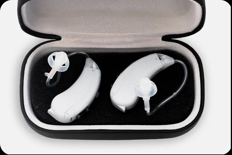 A pair of Lexie Lumen hearing aids in their protective case