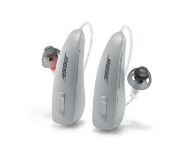 A pair of gray Lexie B2 Powered by Bose hearing aids.