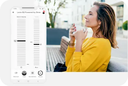 A screenshot of the Lexie Hearing App's home page. To the right is a woman, in suite, looking at her phone.
