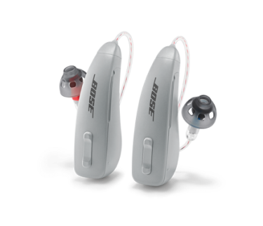 A pair of gray Lexie B2 Powered by Bose hearing aids.